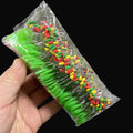 Driftline Rubber Fishing Line Stoppers pack in hand on dark studio background