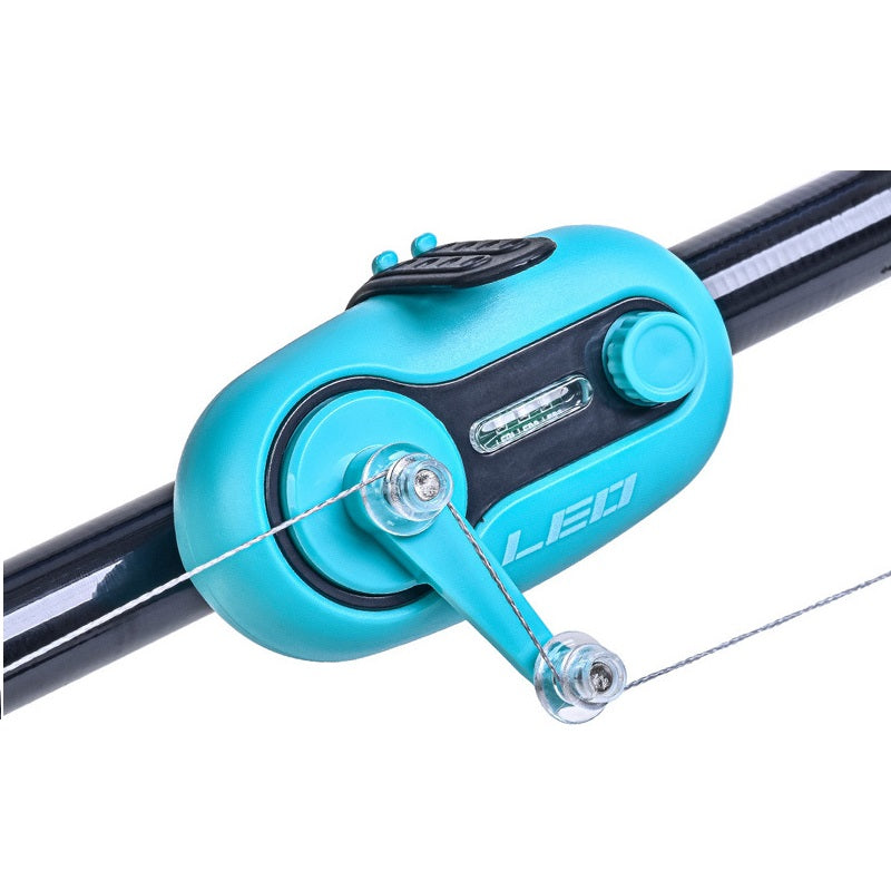 Night fishing bite alarm with LED signal light clipped on a fishing rod